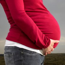 A pregnant EMS dispatcher helps a frantic mother deliver her baby over the phone. 