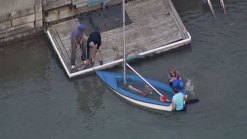 Pair Rescued from Overturned Sailboat