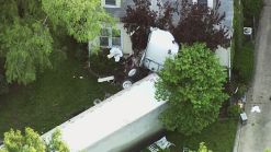 Semi Crashes Into House, Kills Driver