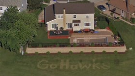 Fan Mows "Go Hawks" On Lawn