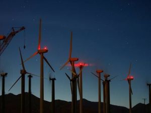 T. Boone Pickens is postponing his plan to build a wind-powered national energy alternative to imported oil.