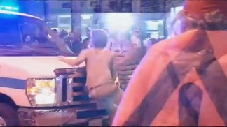 Protesters Try to Stop Police Van
