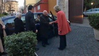 Cardinal George Arrives in Rome