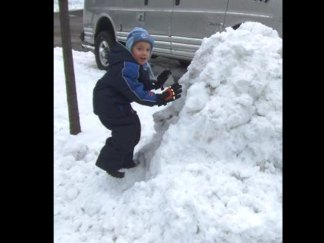 Father, Son Construct Massive Snowman