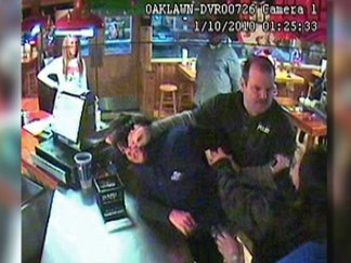 Surveillance Video:  Security Guard, Grandmother Tussle at Hooters