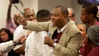 Outbursts, Protests as School Board Closes Schools