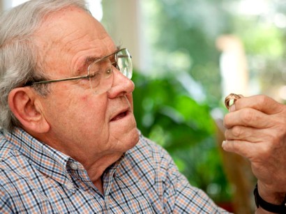 Retired Army Brigadier General Lloyd Rector examines the law school class ring he lost in a Canadian airport 52 years ago. A woman in Newfoundland recently found the ring and got it back to Rector.