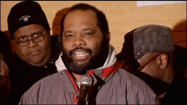 After camping atop a south side motel roof for more than three months, Pastor Corey Brooks on Friday evening boarded a scissor lift and was lowered to the street and greeted by a celebratory crowd.