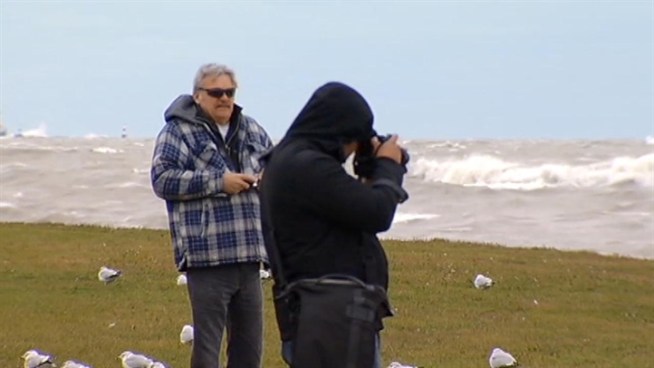 City officials warned people to stay away from the shoreline as high winds continued to create higher-than-normal waves, but some adventurous people -- surfers included -- didn't take that advice. Charlie Wojciechowski reports.