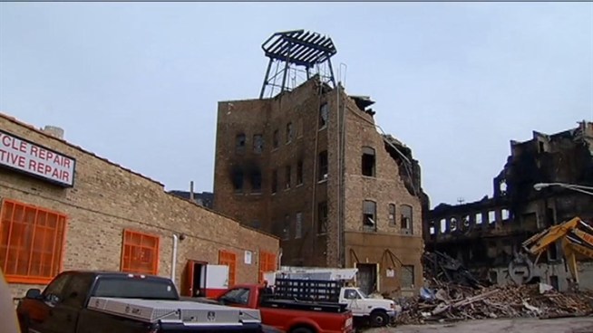 More than 200 firefighters responded around 1:30 a.m. Sunday to the fire at the four-story mixed use building and warehouse in the 2600 block of West Nelson Avenue. Emily Florez reports.