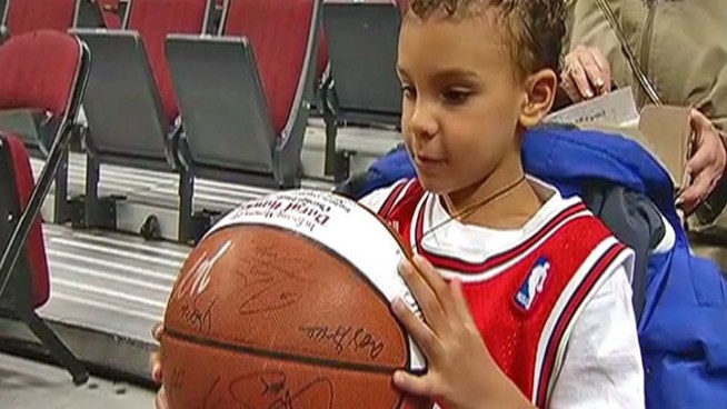 May 26, 2011: Family of NBC Chicago sportscaster who died earlier this month receives ball used in series-winning game.