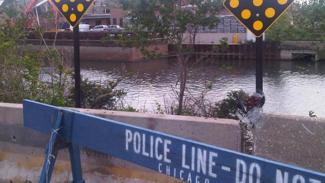 City workers erect a barrier to prevent another fatal traffic accident.