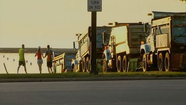A row of Streets & Sanitation trucks lined up Saturday morning across Lake Shore Drive from Columbus Drive to Lake Michigan, preventing any cars from passing from Balbo south to 39th. NBC Chicago reporter Natalie Martinez has the details.