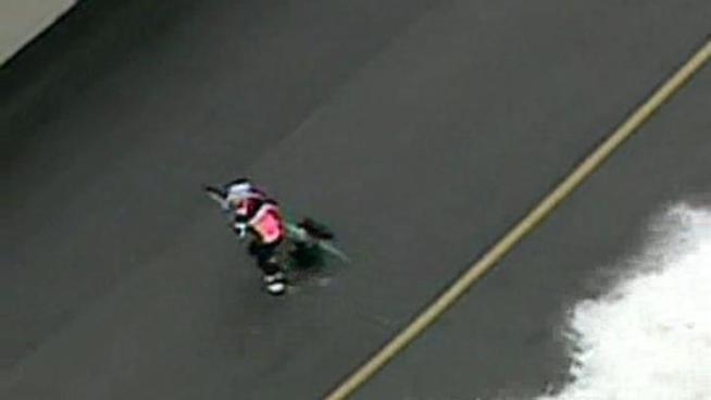 Waves towering 10 to 15 feet tall crashed onto Lake Shore Drive bike paths Friday morning, knocking down several bikers and runners.