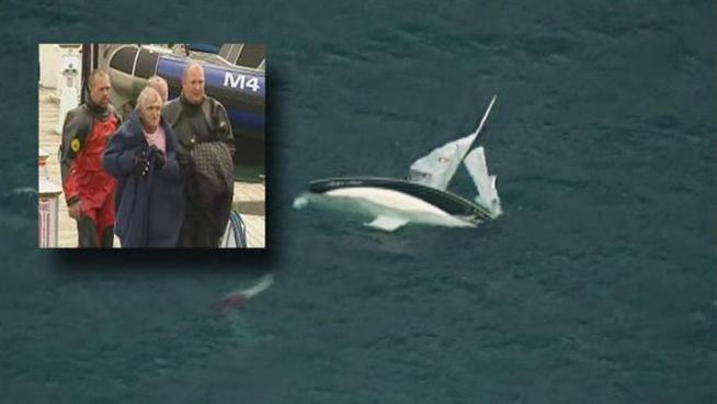 A sailor and a friend were rescued from the waters of Lake Michigan Wednesday afternoon, nearly a year after after his wife rescued him when the same boat overturned.