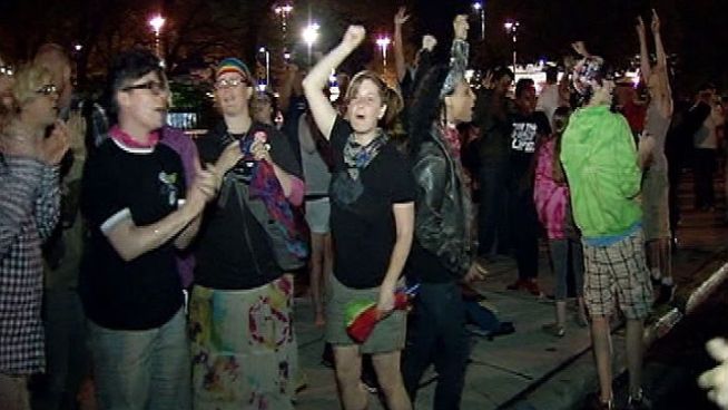 A big crowd waited overnight for a dozen arrested protesters to be released by Chicago Police. Every 15 to 20 minutes, another protester or two would walk out the door and be greeted by cheers.
