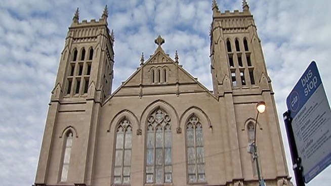 Officials, parishioners say timing, not parade content, is main issue.