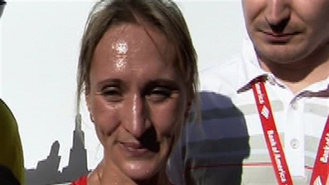 The Russian distance runner sets the pace, and a personal best en route to a commanding third victory.