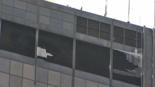 Ice falling from downtown high-rises injured two people, including an off-duty paramedic, and led to the closure of several sidewalks in the Loop on Tuesday afternoon.