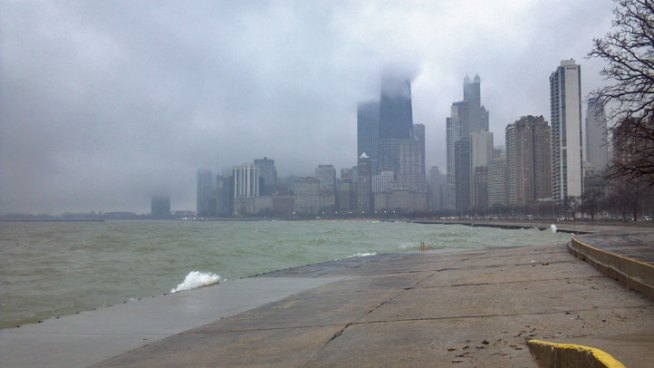 Charlie Wojciechowski found Chicago natives and transplants who mostly seemed to be enjoying the rain and the waves.