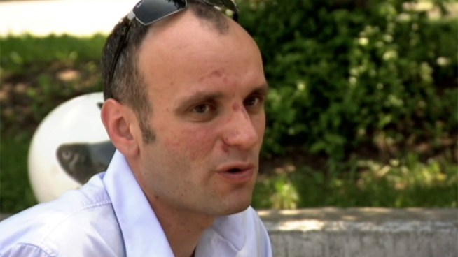 Chris Wilkowski says one moment he was on his scooter, the next he was being dragged on the street.