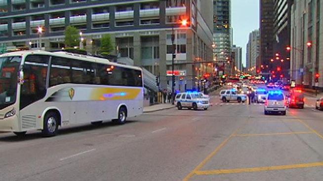 Woman in her mid-20s was struck by a bus while crossing the street.