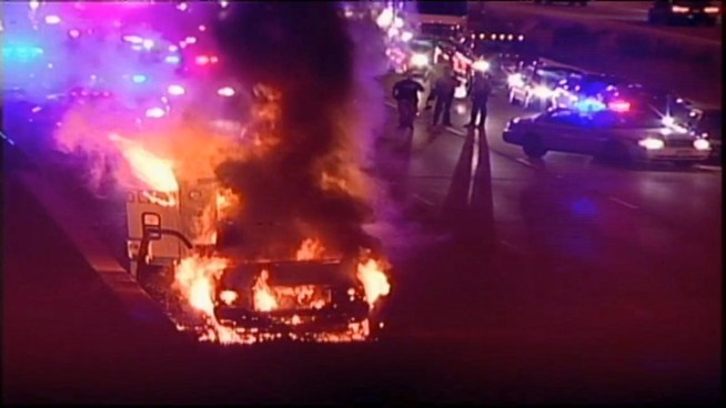 Two Chicago Police officers and the prisoner they were transporting were able to get out of the vehicle safely, according to Chicago News Affairs.