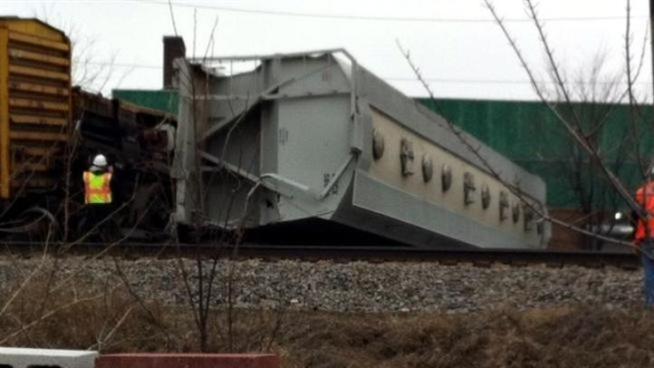 Seven cars of the 72-car train derailed near Cicero and Grand Avenue, with two of them landing on their side.