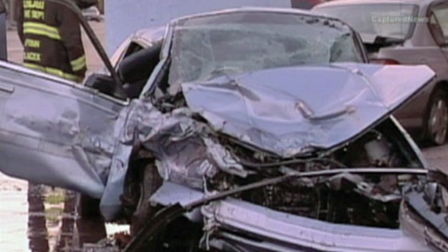 Witnesses say a Cadillac ran a red light, causing this chain-reaction crash Sunday morning.