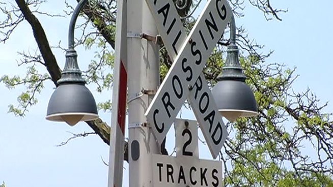 Heroes downplay their roles in helping woman who collapsed on railroad tracks.