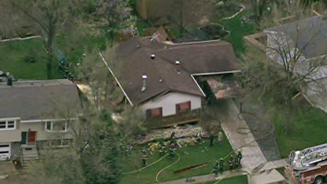 Explosion lifted home off its foundation, but occupants only suffered minor injuries.