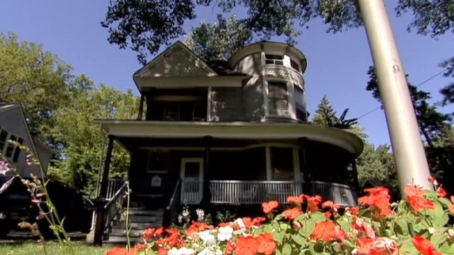 The gray, two-story Victorian on Elm Street in Glen Ellyn has been moved and completely restored.