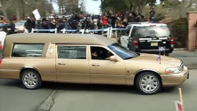 Whitney Houston's body arrives at Fairview Cemetery in Westfield, N.J., where she is set to be buried in a private service Sunday.