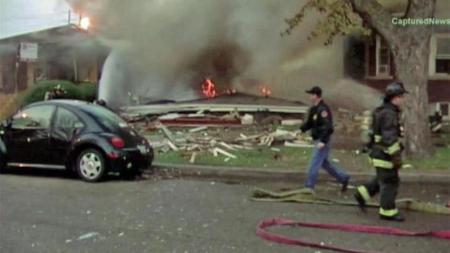A massive explosion levels a house in the West Lawn neighborhood Sunday morning.
