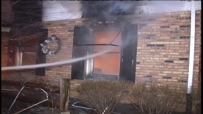 An explosion was reported early Tuesday in south suburban Morris. When fire crews arrived to reports of a garage fire, the structure was completely burned and the door had blasted into the driveway.