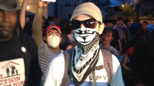 The fewer than 100 protesters who showed up for a meandering march through Chicago's south side were meet by angry residents who questioned the demonstators' motivations.