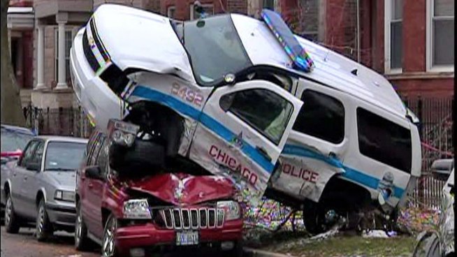 The officer was responding to call of a burglary in progress when he crashed into another vehicle at North Sacramento Avenue and West George Street about 1:15 p.m. Monday. Dick Johnson reports.