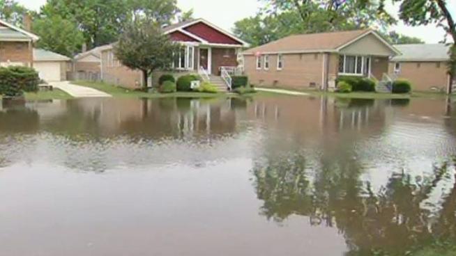 More than three inches of rain fell in Oak Lawn overnight Thursday, overwhelming the community's drainage system and retention pond.
