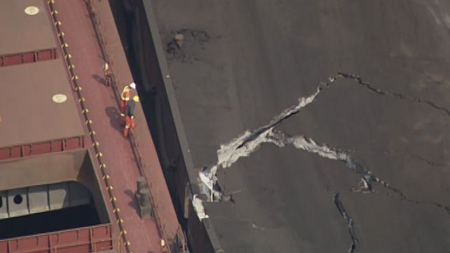 Large cracks are seen in an ArcelorMittal pier after the structure collapsed Tuesday morning under the weight of off-loaded cargo.
