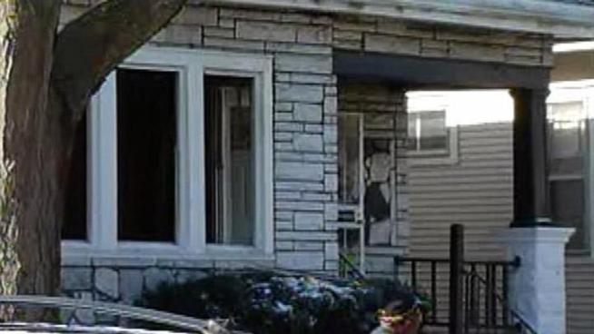 Hours after firefighters saved a woman from a burning home, they found the body of a 7-year-old boy in the attic.