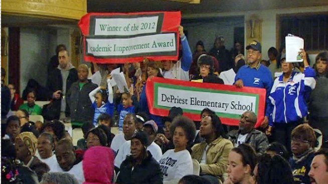 An estimated 500-600 people packed the Church of God in Christ in the city's Austin-North Lawndale neighborhood to protest planned school closures. Dick Johnson reports.