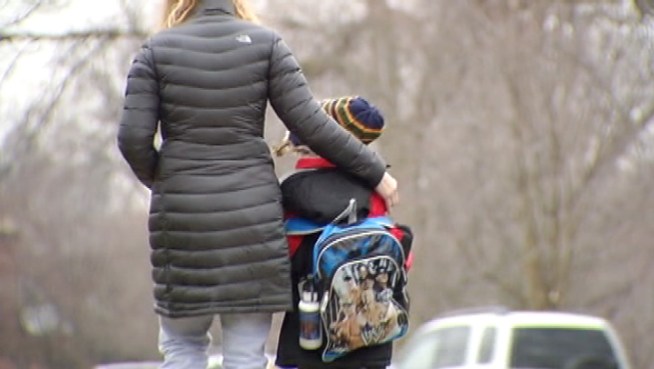 Police officers posted outside schools in west suburban Riverside.