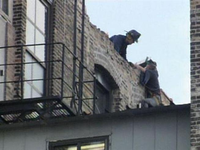 Two people were transported by ambulance from a downtown scaffolding collapse Monday morning, both in serious to critical condition.