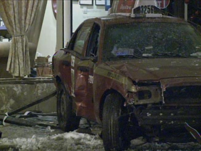 A taxi plowed into a North Side building.