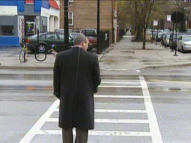 Undercover police officers pose as pedestrians trying to cross the street at a crosswalk.  Vehicles are required by law to yield.