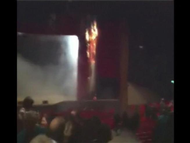 A curtain goes up in flames during a performance at the Star Plaza Theatre in <a title=
