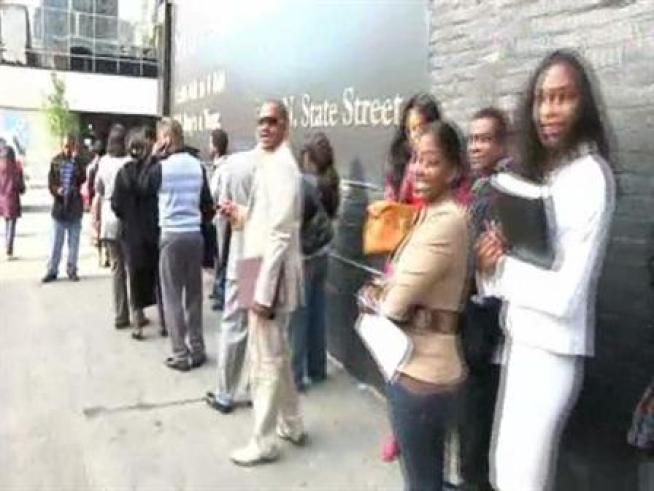 A line of people waited to apply for a job as <a title=