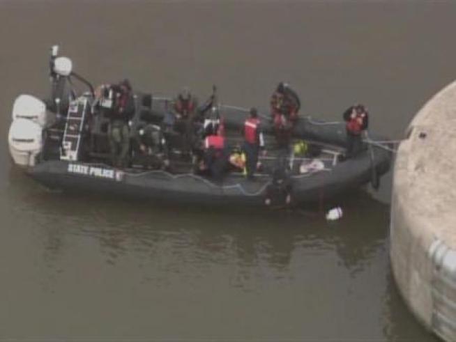 Authorities search an area of the <a title=