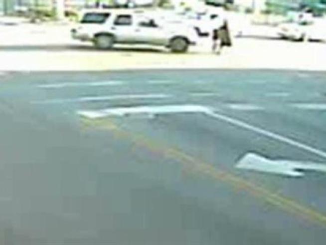Watch surveillance video showing an SUV turning into a woman and child crossing the street at Kedzie and Montrose on May 14, 2009.