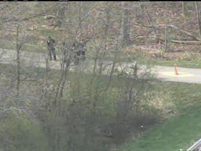 Canine units scour Western Springs for two fugitives suspected of a hit-and-run on an Illinois state trooper.
